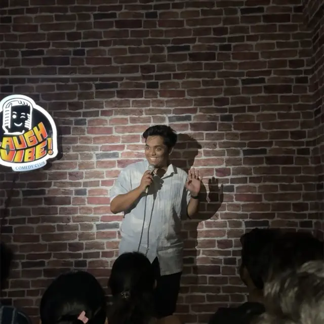 Performing stand-up comedy at Laugh Vibe Comedy Club